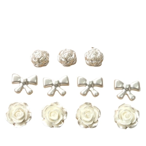 Pearlescent white DIY acrylic accessories including rose flowers and bows for jewelry making