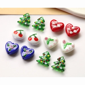 Colorful handmade glass beads set with heart, Christmas tree, and cherry patterns for DIY
