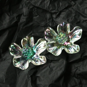 Macro detail of translucent AB iridescent 3D daisy flower petals with green center