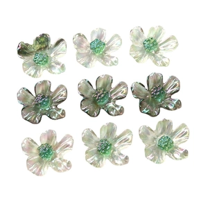 Translucent iridescent daisy resin flower charms with green stamen in a 9-piece set