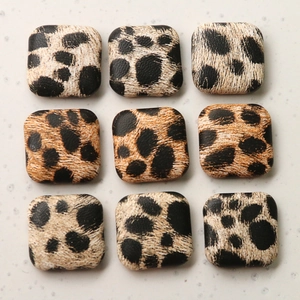 Nine square leopard print buttons with textured faux leather finish for coats and jewelry