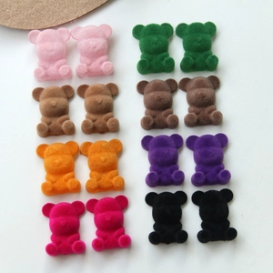 Macro detail of multi-colored flocked teddy bear DIY charms for jewelry making