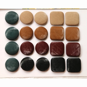 Assorted faux leather buttons in round and square shapes for DIY winter coat accessories