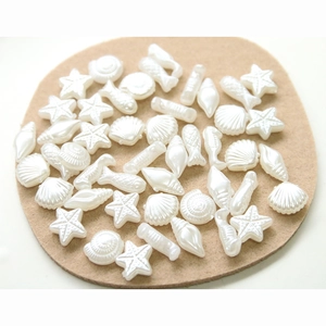 Mix of faux pearl ocean charms featuring starfish and shells for DIY jewelry making