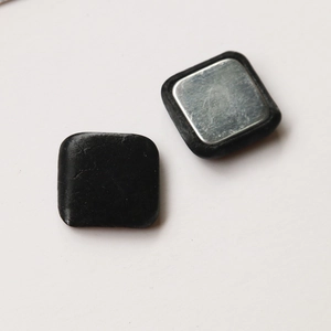 Macro detail of square magnetic fasteners for DIY crafts showing front and back views