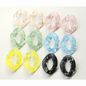 Detail of colorful speckled transparent acrylic link rings for DIY jewelry accessories