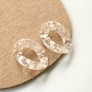 Macro detail of transparent ink-style acrylic links for DIY jewelry making and crafts