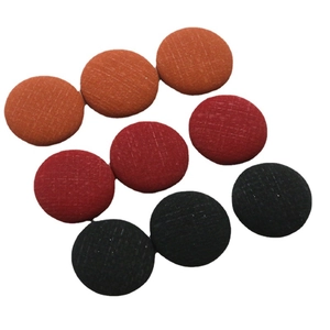 Flat round fabric buttons with grid texture in orange, deep red, and black colors