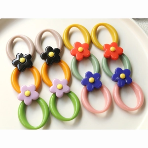 Colorful geometric resin rings with floral accents for DIY jewelry and hair accessories