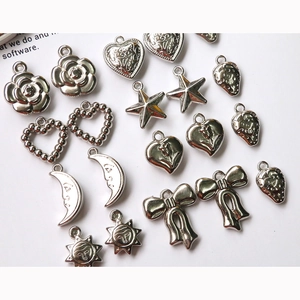 Vintage silver alloy charms collection with heart star moon and bow designs for DIY jewelry