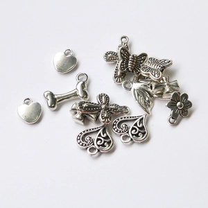 Set of vintage silver alloy charms featuring cross, butterfly, heart and floral DIY pendants
