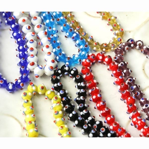 Macro detail of colorful glass Evil Eye beads for DIY jewelry and crafts making