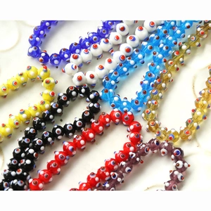 Macro detail of colorful lampwork glass Evil Eye beads for DIY jewelry making