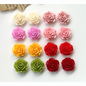 Macro detail of colorful resin rose flower charms for DIY jewelry and phone case crafts
