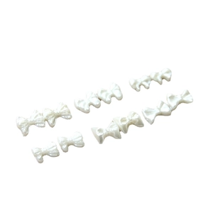 Elegant pearl white bow nail art charms for DIY manicures and jewelry decoration