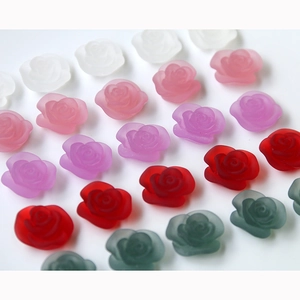 Macro detail of matte resin roses in various colors for DIY jewelry and hair accessories