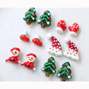 Macro shot of 12-piece Christmas theme handmade glass beads set for jewelry and DIY crafts