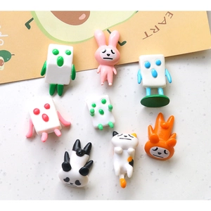 Close-up of cute 3D resin cartoon panda and rabbit mahjong figures for DIY crafts