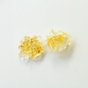 Pair of elegant transparent resin flower earrings featuring real yellow dried flower petals