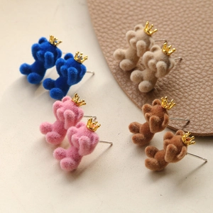 Cute flocked crown bear earrings in navy, pink, beige and brown colors display