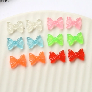 Nœuds en résine luminescente pour nail art en six couleurs translucides assorties