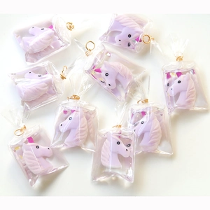Cute purple resin unicorn pendant in individual transparent bag with gold metal ring