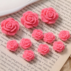 Macro shot of sweet pink flocked rose flowers in mixed sizes for DIY jewelry crafts