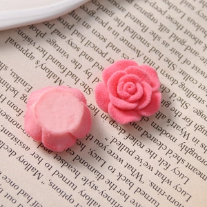 Detail view showing front and back of pink flocked rose cabochons for DIY crafts