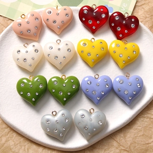 Colorful resin heart charms with rhinestones and gold loops for DIY jewelry making