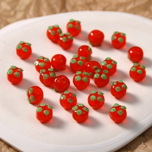Handgefertigte rote Glas-Persimone-Perlen mit grünen Akzenten für DIY-Schmuck und Accessoires