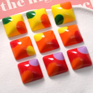 Colorful geometric square resin charms with vibrant polka dots for DIY jewelry making