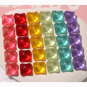 Macro shot of 30 square glitter resin charms in candy colors for DIY jewelry making