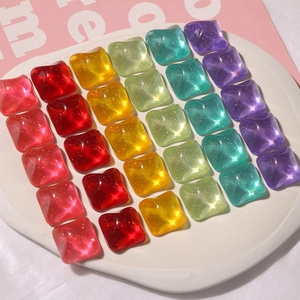 Close-up of square glitter resin charms in vibrant candy colors for DIY jewelry making