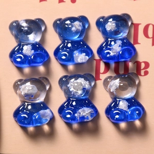 Macro view of blue gradient gummy bear resin charms with cloud-like inclusions