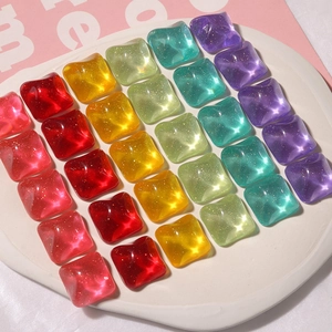 Close-up of square glitter resin patches in vibrant candy colors for DIY jewelry making