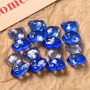 Macro view of blue gradient resin bear charms with cloud inlay for DIY craft