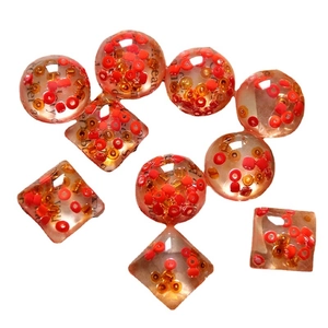 Clear resin beads with red gold tiny pearls and vintage text paper inserts