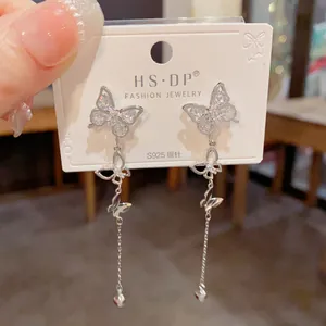Detail of S925 silver needle butterfly earrings with sparkling tassel and rhinestones