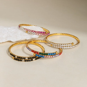 Detail of 18k gold plated tennis bracelets with double row colorful crystals and spring design