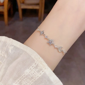 Elegant star and moon bracelet in silver metal with sparkling crystals for women
