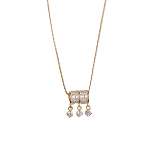 Elegante gouden franje ketting met sprankelende cilinder hanger en kleine ronde kristallen