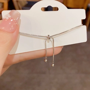 Detail of adjustable slider buckle on a silver box chain bracelet for women