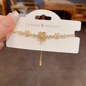 Elegant gold cherry blossom pull-out bracelet with zircon floral accents for women
