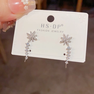 Elegant silver star earrings with sparkling crystals and flowing curved drop design