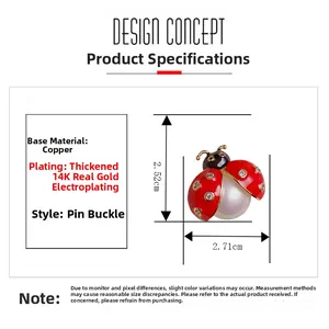 Detail view of ladybug brooch with white pearl body and red enamel wings with crystals