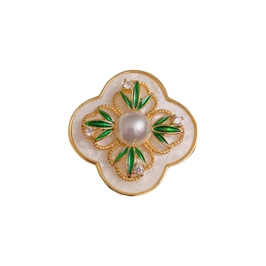 Vintage Chinese style floral brooch with white pearl, green bamboo leaves and gold trim