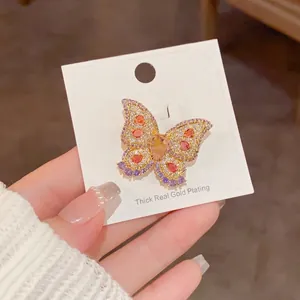 Micro-pave colorful crystal butterfly brooch with 18k gold plating on display card