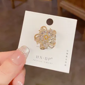Detail showing high-quality five-petal zircon brooch with thick real gold plating
