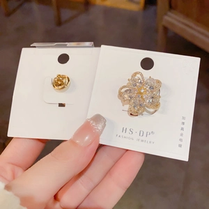 French luxury flower brooch with gold plating and sparkling zircon petals on card
