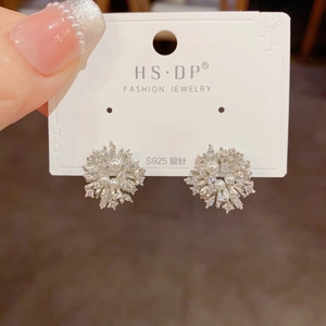 Detail of S925 silver snowflake earrings featuring marquise crystals and white pearls
